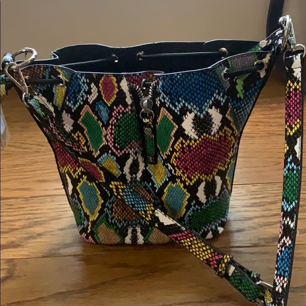 snake skin crossbody bucket purse.